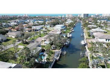 Aerial view of a waterfront community with canals, private docks, and stunning views of the coastline at 1633 Ridgewood Ln, Sarasota, FL 34231