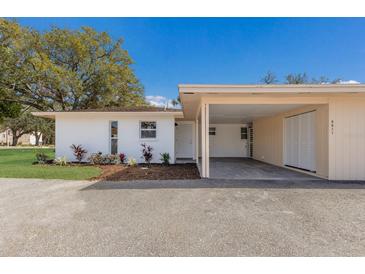 Charming one-story home with attached carport and freshly landscaped yard, and a classic Florida feel at 5011 Live Oak Cir # 65, Bradenton, FL 34207