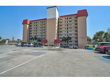 Multi-story building with ample parking, landscaped entry, and clearly labeled signage for Venice Costa Brava at 244 Saint Augustine Ave # 905, Venice, FL 34285