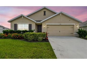 Charming single-Gathering home with a well-manicured lawn and beautiful landscaping at 4918 Gray Owl Ter, Palmetto, FL 34221