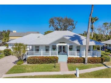 Charming single story home featuring a covered porch, beautiful landscaping, and a serene neighborhood setting at 8012 18Th W Ave, Bradenton, FL 34209