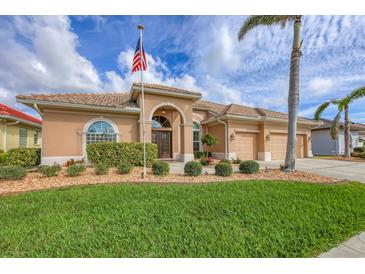 Charming single-story home featuring a well-manicured lawn, lush landscaping, and a welcoming double-door entry at 854 Dahoon Cir, Venice, FL 34293