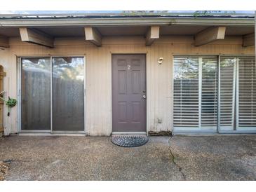 Exterior shot of the front entrance, with a patio and sliding glass doors at 500 N Jefferson Ave # B2, Sarasota, FL 34237