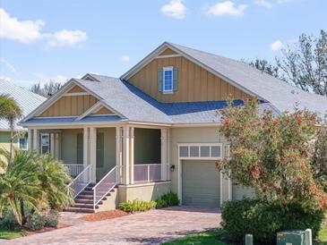 Charming home featuring a brick driveway, inviting front porch and attached garage at 8135 37Th Avenue W Cir, Bradenton, FL 34209