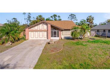 Charming single-story home with attached garage and mature landscaping at 1224 Inverness St, Port Charlotte, FL 33952