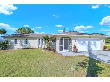 Charming single-story home with well-maintained lawn and attached two-car garage at 2640 Geneva Rd, Venice, FL 34293