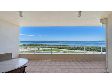 Breathtaking balcony view of the beautiful ocean and golf course beyond the railings at 3040 Grand Bay Blvd # 234, Longboat Key, FL 34228