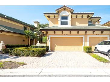 Inviting two-story home features a two-car garage and beautiful landscaping at 6512 Moorings Point Cir # 201, Lakewood Ranch, FL 34202