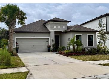 Charming one story home with a well-manicured yard and a two car garage at 10179 Milky Way Cir, Sarasota, FL 34241