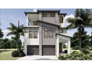 Modern two-story home with a two-car garage, balcony, and tropical landscaping at 4903 Commonwealth Dr, Sarasota, FL 34242