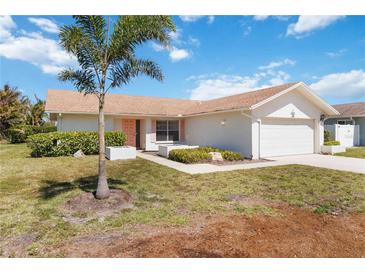 Charming single-story home featuring a well-maintained yard, lush landscaping, and a two-car garage, adding curb appeal at 6812 19Th W Ave, Bradenton, FL 34209