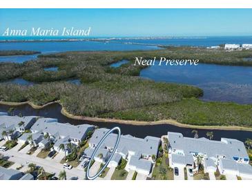 Wonderful aerial view of a condo community near Anna Maria Island and the Neal Preserve with beautiful landscaping at 1218 Spoonbill Landings Cir, Bradenton, FL 34209
