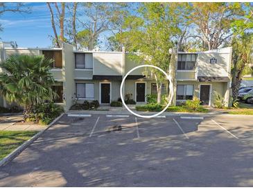 Inviting two-story condo with assigned parking and landscaping offering a blend of comfort and convenience at 4906 25Th W St # 106, Bradenton, FL 34207