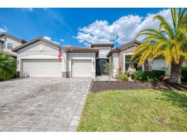 Stunning two-story home featuring a paver driveway and a two-car garage at 18032 Polo Trl, Bradenton, FL 34211