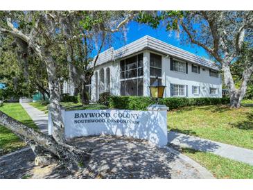 Inviting Baywood Colony condo featuring lush landscaping, and a well-maintained facade at 1711 Southwood St # 1711, Sarasota, FL 34231
