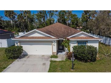 Charming single-story home featuring a well-maintained lawn and attached two-car garage at 3514 14Th E Ct, Ellenton, FL 34222