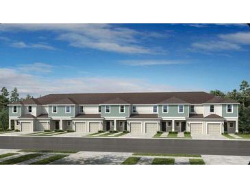 The townhouse style homes have multiple garages and are painted in complementary colors at 15116 Cuzcorro Ct, Nokomis, FL 34275