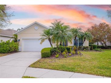 Charming single-story home with well-manicured lawn and professional tropical landscaping at 7351 Meeting St, Bradenton, FL 34201