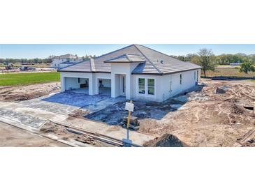 Under construction, this property features a modern elevation with a two-car garage and ample space for landscaping at 7561 Nighthawk Dr, Sarasota, FL 34241