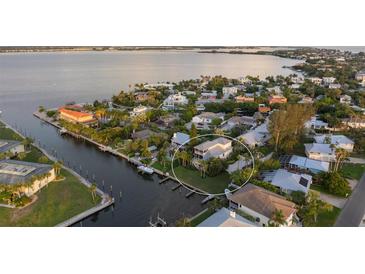 Beautiful waterfront home with mature landscaping, private boat dock and easy access to the bay at 504 59Th St, Holmes Beach, FL 34217