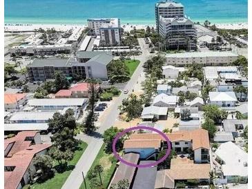 Aerial view showcases the neighborhood near the beach, highlighting the property's location at 722 S Blvd Of The Presidents # 201, Sarasota, FL 34236