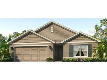 Charming single-story home with beige siding, a two-car garage, and manicured landscaping at 4611 Dusky Dawn Ln, Palmetto, FL 34221