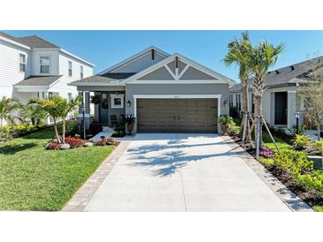 Charming single-story home featuring a well-manicured lawn and a two-car garage at 4253 Pond Brook Ct, Bradenton, FL 34211