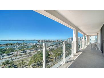 Breathtaking balcony view overlooking the water and city skyline, offering an ideal spot for relaxation and entertainment at 101 S Gulfstream Ave # 16K, Sarasota, FL 34236
