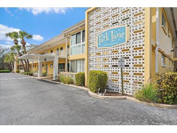 Park Lane Condominium exterior shows the building's entrance, signage, and well-maintained landscaping at 2155 Wood St # A20, Sarasota, FL 34237
