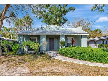 Charming single-story home with well-maintained landscaping and a welcoming walkway to the front door at 2021 Central Ave, Sarasota, FL 34234