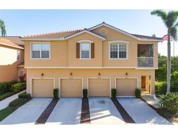 Charming multi-Gathering home featuring multiple garages and a tile roof, exuding curb appeal and functionality at 3456 Parkridge Cir # 33-105, Sarasota, FL 34243