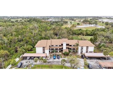 Beautiful condominiums surrounded by lush greenery and golf course views, creating a serene living environment at 6002 Oak Creek Ln # 1925, Bradenton, FL 34210