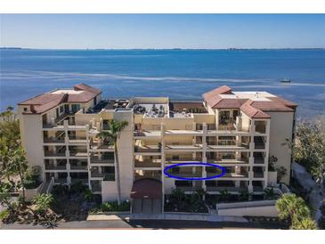 Beautiful condo building with balconies overlooking scenic water views and lush landscaping at 6460 Mourning Dove Dr # 204, Bradenton, FL 34210