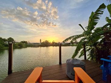 Beautiful waterfront view from the private dock, perfect for relaxing and enjoying the sunset at 1248 Jefferson Dr, Englewood, FL 34224