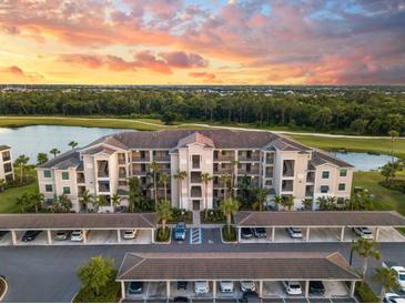 Beautiful aerial view of condo complex with sunset, golf course and pond view at 17510 Gawthrop Dr # 305, Bradenton, FL 34211