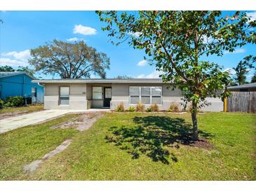 Charming single-story home with fresh exterior paint and a well-maintained lawn, presenting great curb appeal at 2361 Rose St, Sarasota, FL 34239