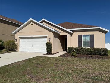 Charming single-story home featuring a two-car garage and well-maintained landscaping at 15517 Rose Grove Dr, Bradenton, FL 34212