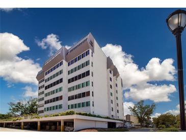 Modern building with multi-colored tinted windows at 1080 Peppertree W Ln # 602, Sarasota, FL 34242