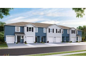 New two-story townhomes featuring attached garages, neutral paint schemes, and updated architectural details at 11826 Davis Dr, Largo, FL 33774