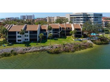 Waterfront condos feature lush landscaping, direct water access, and scenic views of the intercoastal waterway at 1900 Cove Ii Pl # 133, Sarasota, FL 34242