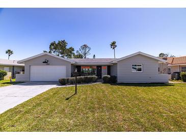 Charming single-story home with a well-manicured lawn and attached one car garage at 7307 14Th W Ave, Bradenton, FL 34209