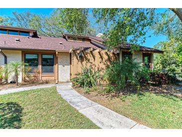 Charming single story home featuring mature landscaping and a welcoming front walkway at 7615 4Th W Ave # 7615, Bradenton, FL 34209