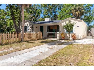 Charming single-story home featuring a cozy front porch and a quaint picket fence at 919 N Osprey Ave, Sarasota, FL 34236