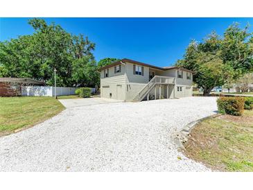 Charming two-story home with a front yard featuring white gravel and a convenient attached garage at 5311 San Jose Dr, Sarasota, FL 34235