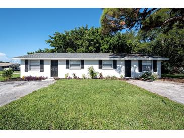 Charming duplex featuring a well-maintained lawn and landscaping, with updated windows and freshly painted exterior at 6434 5Th W St, Bradenton, FL 34207