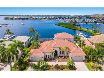 Amazing aerial view of home with private dock, waterway, marina and open bay access at 805 3Rd E St, Palmetto, FL 34221