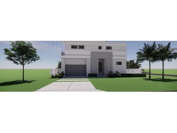 Modern two-story home featuring a gray exterior, a two-car garage, and clean landscaping at 610 Hibiscus Way, Longboat Key, FL 34228