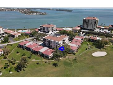 An aerial view of a waterfront condo complex, a golf course, and intercoastal waterway at 6269 Palma Del Mar S Blvd # 308, St Petersburg, FL 33715