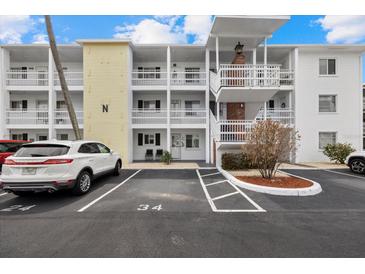 Condo building featuring multiple levels and parking, offering a convenient and accessible living space at 1536 Leisure Dr # N4, Bradenton, FL 34207