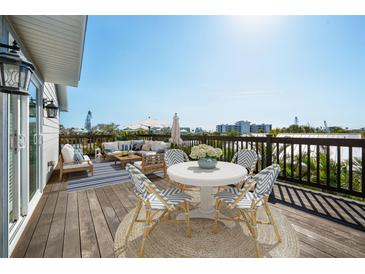 Exterior deck with seating, tables, decor and scenic views at 5512 Avenida Del Mare, Sarasota, FL 34242